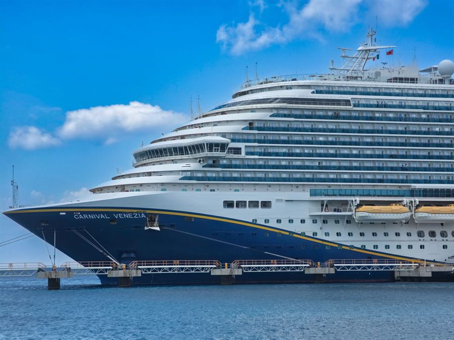 Carnival Venezia cruise ship docked under a clear blue sky