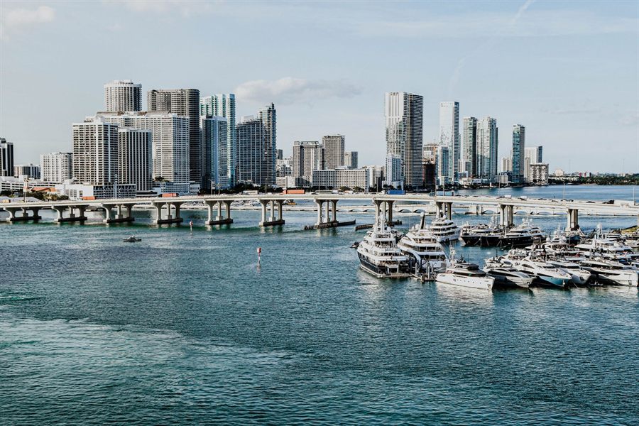 Miami skyline rising above a marina full of boats on Biscayne Bay