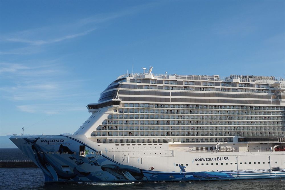 Norwegian Bliss docked in Victoria, British Columbia, under a clear blue sky